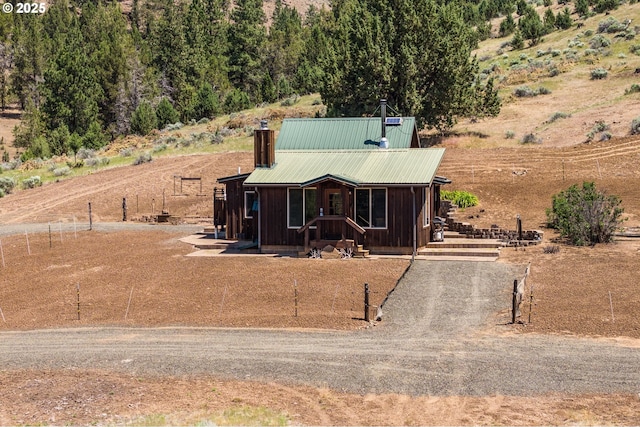 0 Hwy 395, Mount Vernon, OR 97865 - chalet / cabin with a chimney, a metal roof, and a porch