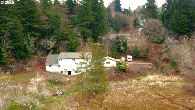 drone / aerial view with a view of trees