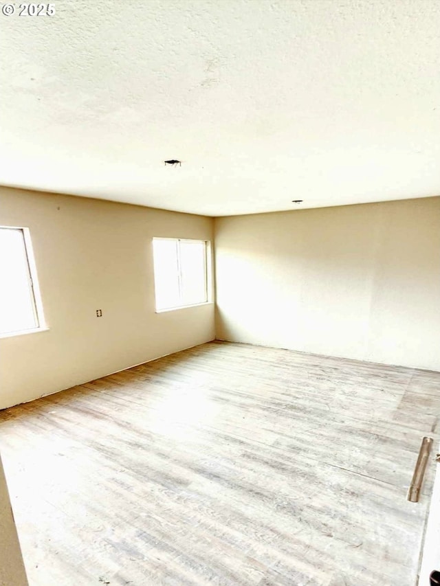 empty room with wood finished floors