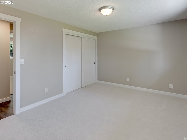 907 NW 90th St, Vancouver, WA 98665 - unfurnished bedroom with carpet floors, a textured ceiling, and a closet