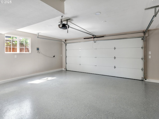 907 NW 90th St, Vancouver, WA 98665 - garage featuring a garage door opener and baseboards