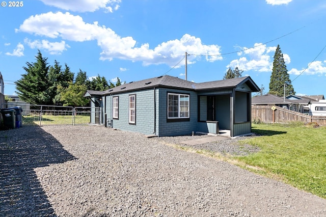 2745 C St, Springfield, OR 97477 - view of home's exterior with a gate and gravel driveway