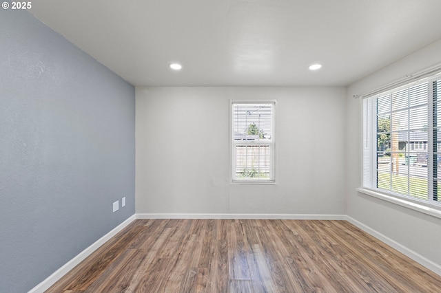 2745 C St, Springfield, OR 97477 - empty room featuring wood finished floors, plenty of natural light, baseboards, and recessed lighting