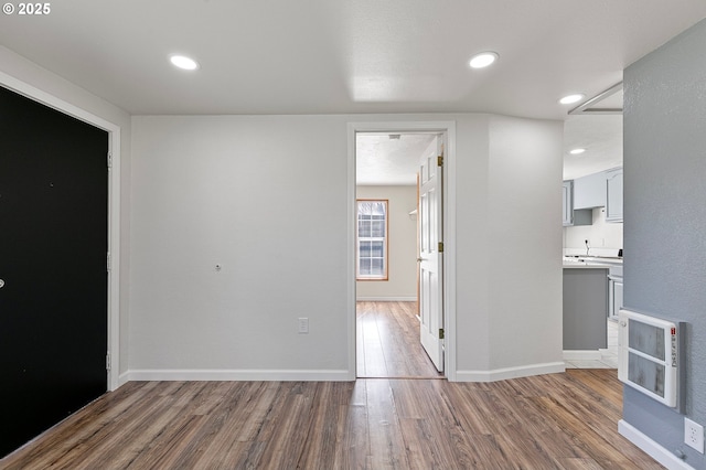 2745 C St, Springfield, OR 97477 - unfurnished room featuring wood finished floors, heating unit, baseboards, and recessed lighting