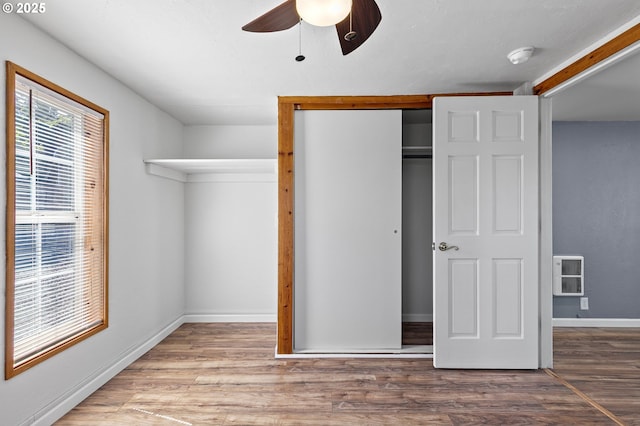 2745 C St, Springfield, OR 97477 - unfurnished bedroom with wood finished floors, a closet, baseboards, and ceiling fan