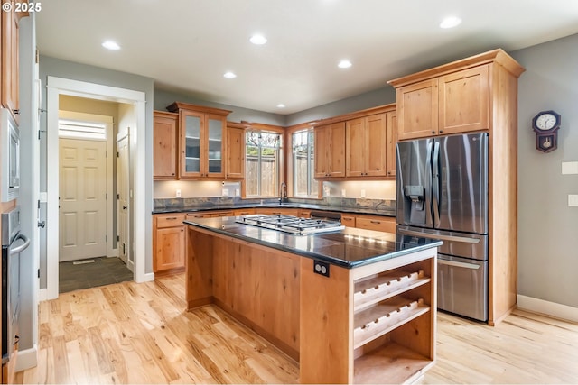 14390 SW Connor Pl, Portland, OR 97224 - kitchen featuring stainless steel appliances, open shelves, a center island, light wood-type flooring, and recessed lighting