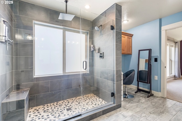 14390 SW Connor Pl, Portland, OR 97224 - full bathroom featuring a shower stall, wood finished floors, and plenty of natural light
