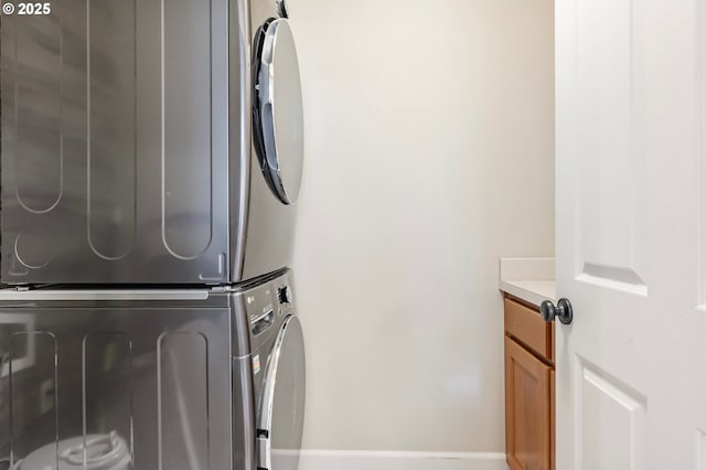 14390 SW Connor Pl, Portland, OR 97224 - laundry room with stacked washer / drying machine and cabinet space