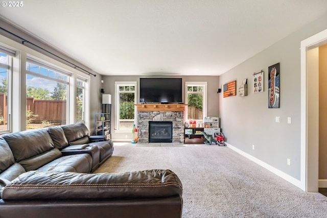 14390 SW Connor Pl, Portland, OR 97224 - carpeted living room with baseboards and a stone fireplace