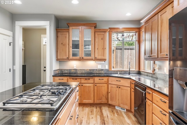 14390 SW Connor Pl, Portland, OR 97224 - kitchen featuring stainless steel appliances, light wood-style floors, glass insert cabinets, and recessed lighting