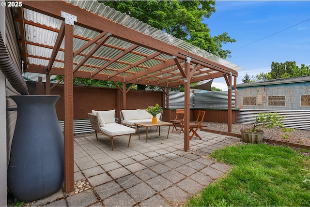 view of patio / terrace with an outdoor living space and fence