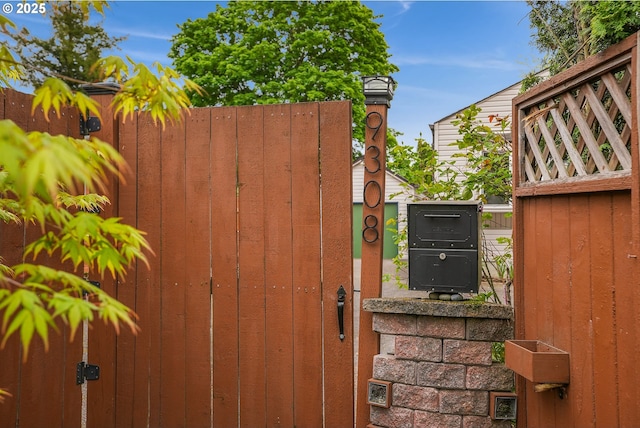 view of gate featuring fence