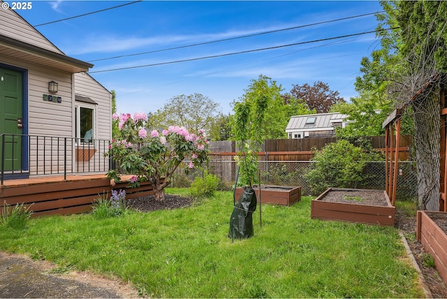 view of yard featuring a fenced backyard and a vegetable garden
