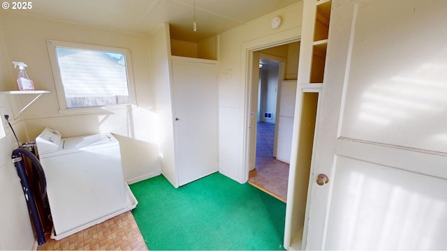 laundry area with washer / clothes dryer and carpet