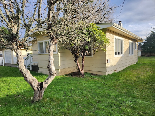 view of property exterior featuring a lawn