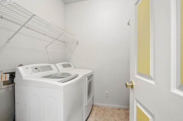 18522 SW Mcclarey Dr, Beaverton, OR 97007 - laundry area featuring washer and clothes dryer and baseboards