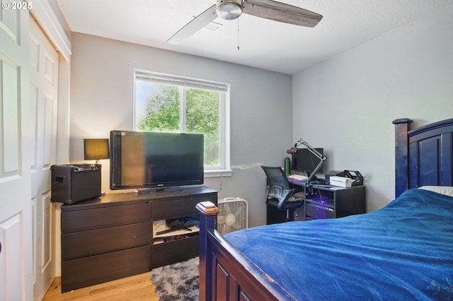 18522 SW Mcclarey Dr, Beaverton, OR 97007 - bedroom with wood finished floors, ceiling fan, and an office area