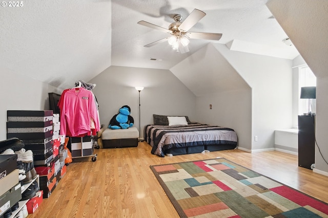 18522 SW Mcclarey Dr, Beaverton, OR 97007 - bedroom with wood finished floors, a ceiling fan, lofted ceiling, and a textured ceiling
