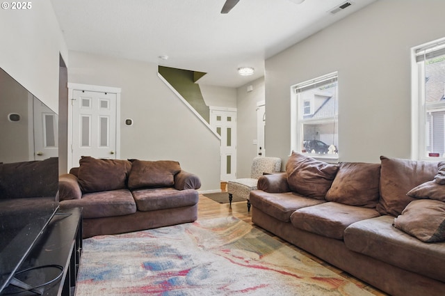18522 SW Mcclarey Dr, Beaverton, OR 97007 - living area with stairway, wood finished floors, and a ceiling fan