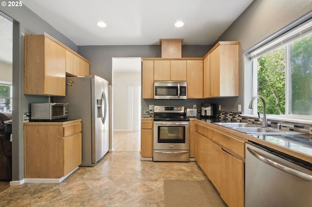 18522 SW Mcclarey Dr, Beaverton, OR 97007 - kitchen featuring appliances with stainless steel finishes, a sink, light brown cabinetry, dark countertops, and recessed lighting
