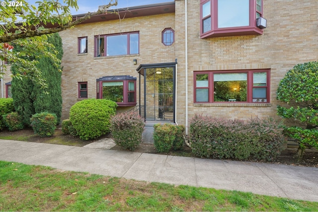 townhome / multi-family property with brick siding