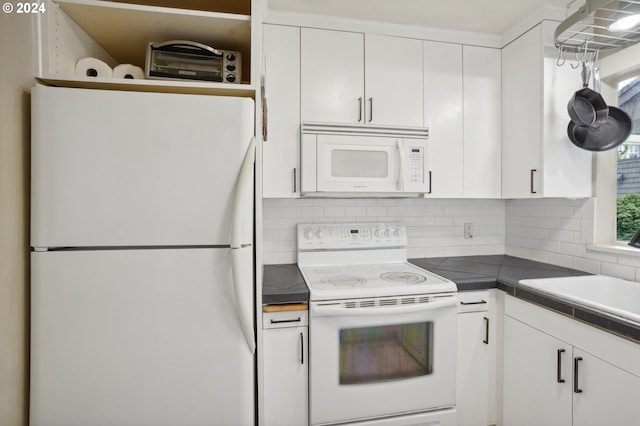 kitchen with backsplash, white cabinetry, a sink, and white appliances