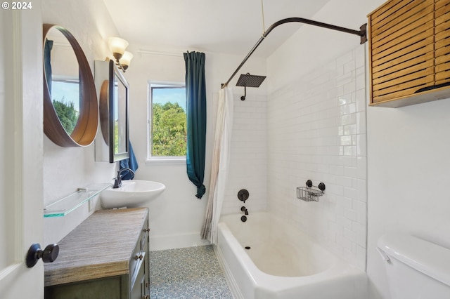 bathroom with toilet, vanity, baseboards, and shower / tub combo with curtain