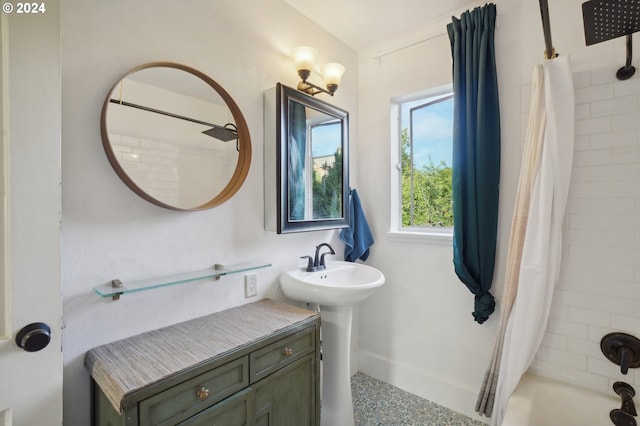 full bath with baseboards