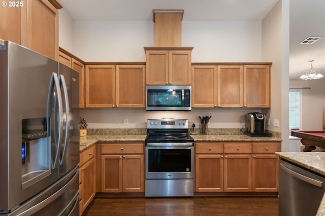31529 SE Eagle Cliff Ln, Eagle Creek, OR 97022 - kitchen with stainless steel appliances, dark wood-style floors, light stone countertops, and a chandelier