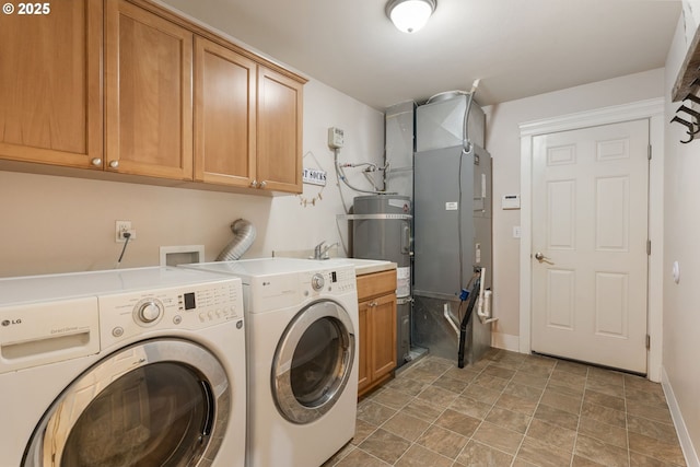 31529 SE Eagle Cliff Ln, Eagle Creek, OR 97022 - laundry room featuring separate washer and dryer, cabinet space, baseboards, and stone finish floors
