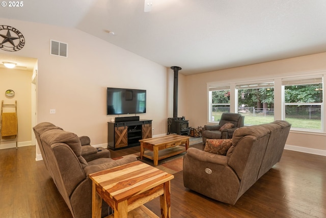 31529 SE Eagle Cliff Ln, Eagle Creek, OR 97022 - living area with lofted ceiling, a wood stove, dark wood finished floors, baseboards, and healthy amount of natural light
