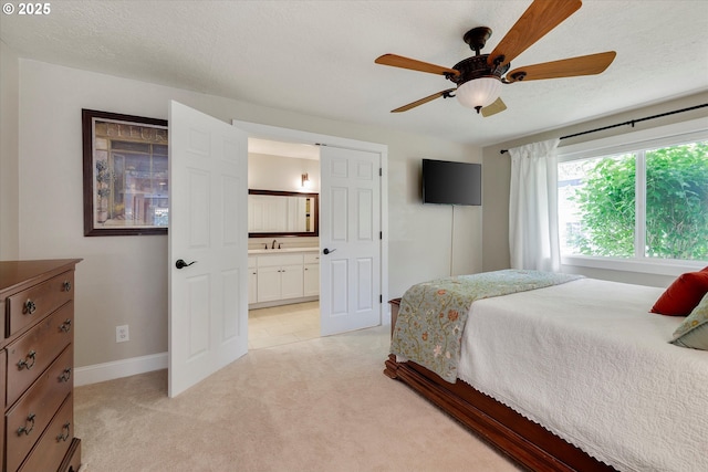 2648 SE Risley Ave, Milwaukie, OR 97267 - bedroom with light colored carpet, ensuite bathroom, and a ceiling fan