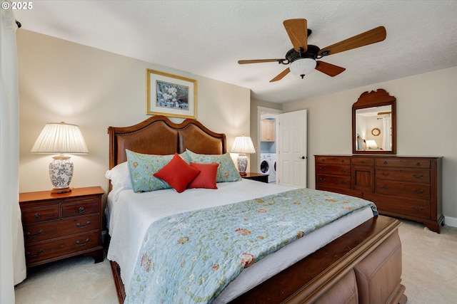 2648 SE Risley Ave, Milwaukie, OR 97267 - bedroom with light colored carpet, washer / clothes dryer, and a ceiling fan