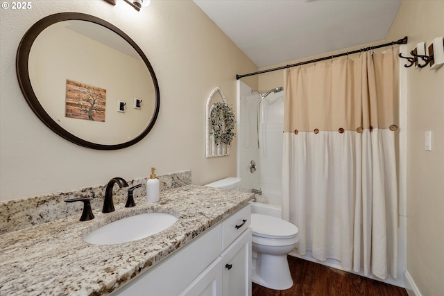 2648 SE Risley Ave, Milwaukie, OR 97267 - full bathroom featuring vanity, wood finished floors, and shower / bath combo