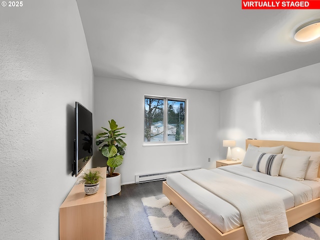 bedroom with a baseboard heating unit