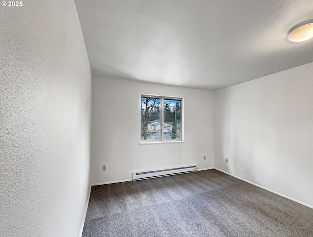 empty room featuring a baseboard radiator, a textured wall, dark colored carpet, and baseboards