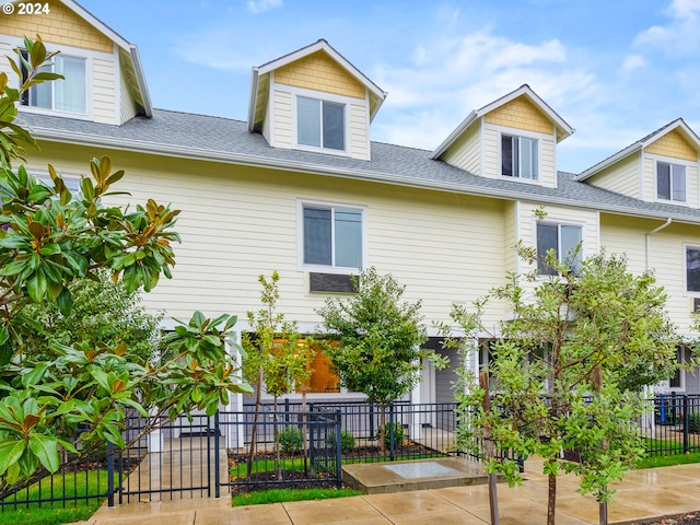 10827 E Burnside St, Portland, OR 97035 - view of front of house with a fenced front yard and a shingled roof