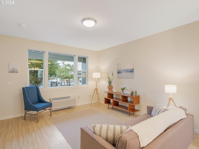 interior space featuring a wall mounted air conditioner and light wood-type flooring