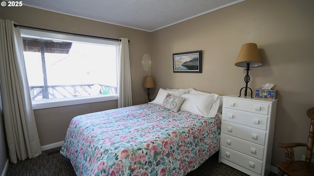 145 E Franklin Ave, Dayville, OR 97825 - bedroom featuring dark colored carpet and crown molding
