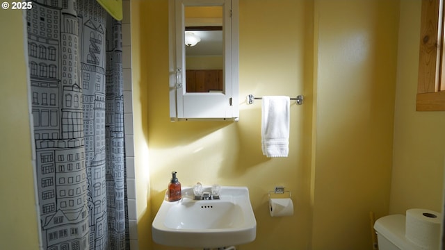 145 E Franklin Ave, Dayville, OR 97825 - bathroom featuring toilet and curtained shower