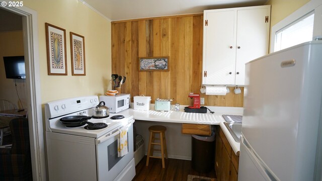 145 E Franklin Ave, Dayville, OR 97825 - kitchen featuring white appliances, white cabinets, dark wood-style floors, and light countertops