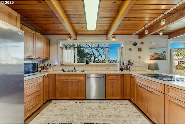 kitchen with stainless steel appliances, sink, backsplash, and beamed ceiling