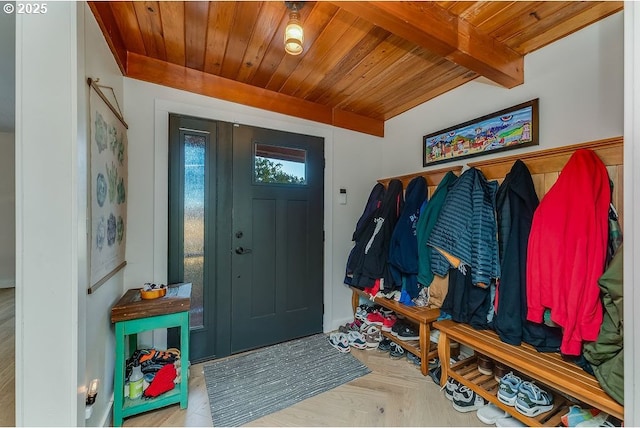 mudroom featuring parquet floors, wooden ceiling, and beamed ceiling