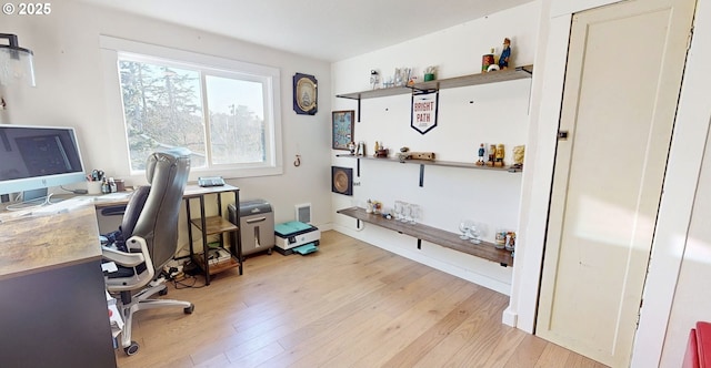 office area with light hardwood / wood-style floors