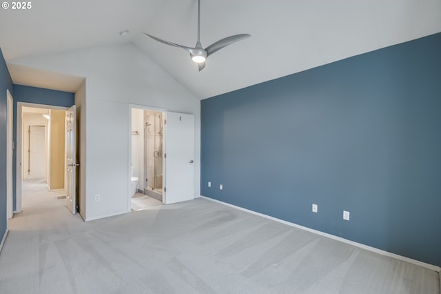 unfurnished bedroom featuring carpet flooring, baseboards, ensuite bathroom, and high vaulted ceiling