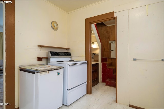118 SW Brook St, Newport, OR 97365 - kitchen with white range with electric stovetop, light flooring, and crown molding