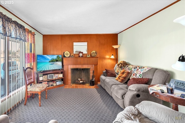 living area with a fireplace with flush hearth, carpet flooring, and crown molding