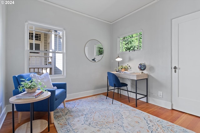home office with wood finished floors, baseboards, and ornamental molding