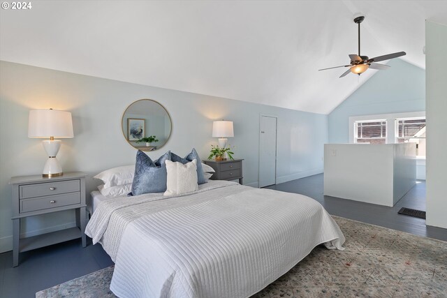 bedroom with vaulted ceiling, a ceiling fan, baseboards, and wood finished floors