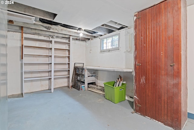 below grade area featuring wood walls
